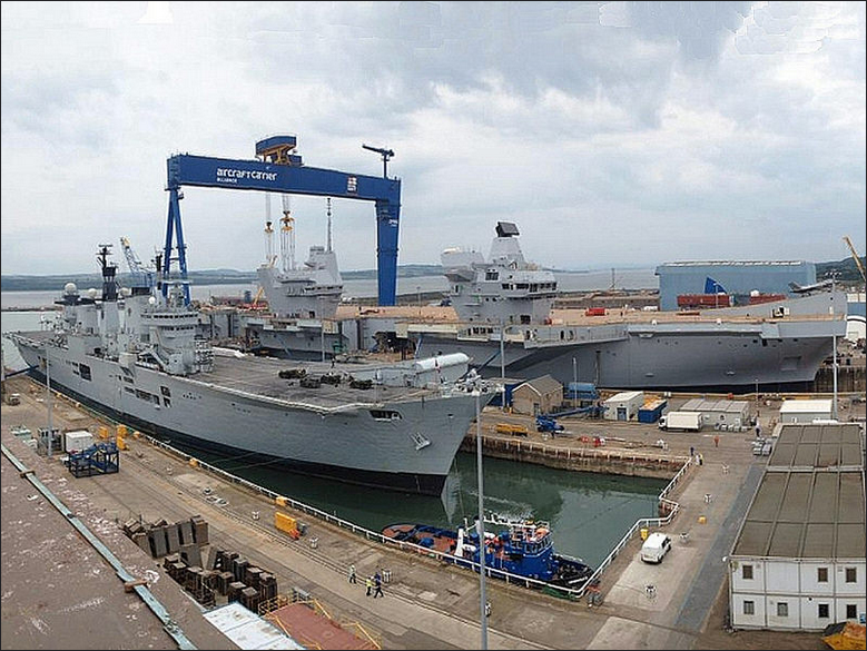 HMS Queen Elizabeth ready for christening, with HMS Illustrious in the foreground. (Photo by Jeff Head)