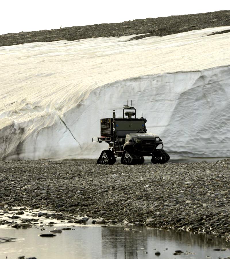 At CFS Alert, the Multi-Agent Tactical Sentry (MATS) UGV travels through rough Arctic terrain during an autonomous path-following test without the use of GPS. The Canadian Armed Forces Joint Arctic Experiment (CAFJAE) 2014 tests autonomous technology for Arctic conditions and explores its potential for future concepts of military operations through experiments carried out August 2014 at Canadian Forces Station Alert, Nunavut.  CAF and Defence Research and Development Canada's (DRDC) JAE work will benefit multiple government partners and centers around a fictitious satellite crash with hazard identification, telecommunication and other search and rescue tasks.